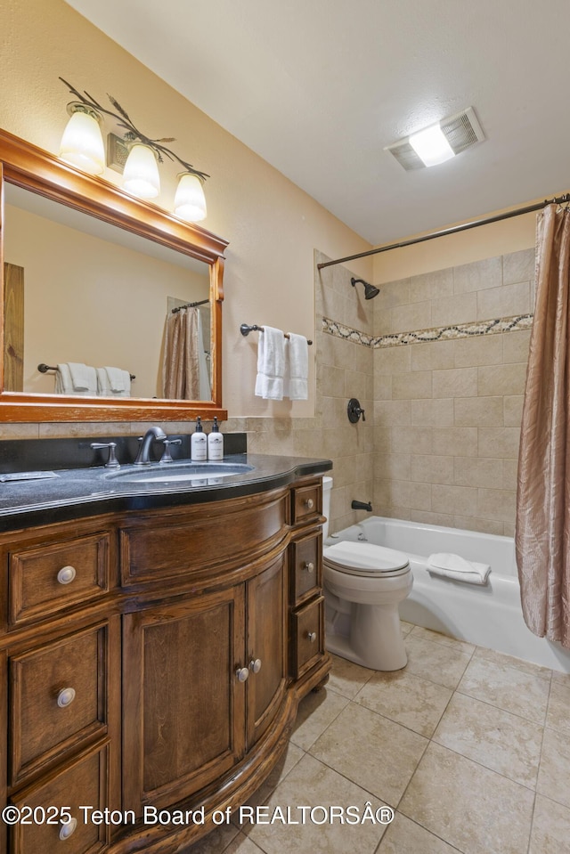 7250 N Rachel Way Unit 6, Teton Village, WY 83025 - bathroom featuring tile patterned floors, toilet, shower / bath combination with curtain, and vanity