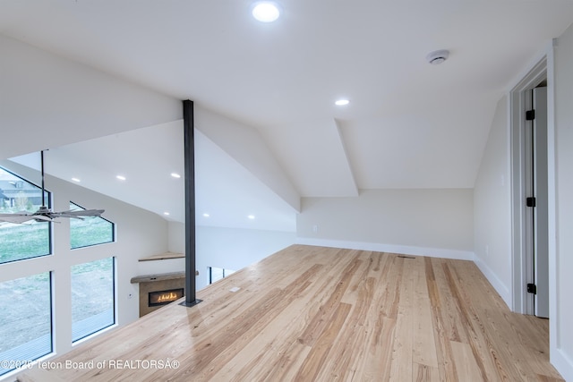 4444 Tails Down Rd, Tetonia, ID 83452 - additional living space with a glass covered fireplace, vaulted ceiling, wood finished floors, recessed lighting, and baseboards