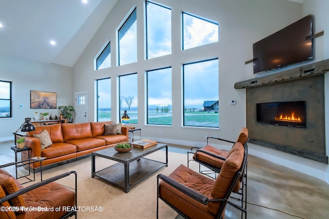4444 Tails Down Rd, Tetonia, ID 83452 - living area featuring high vaulted ceiling, a lit fireplace, baseboards, and recessed lighting