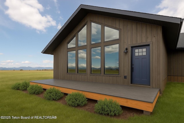 4444 Tails Down Rd, Tetonia, ID 83452 - view of side of property featuring a yard and a deck with mountain view