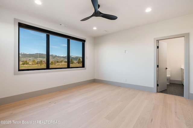 1404 Canyon Sunrise, Driggs, ID 83422 - unfurnished room featuring wood finished floors, recessed lighting, a ceiling fan, and baseboards