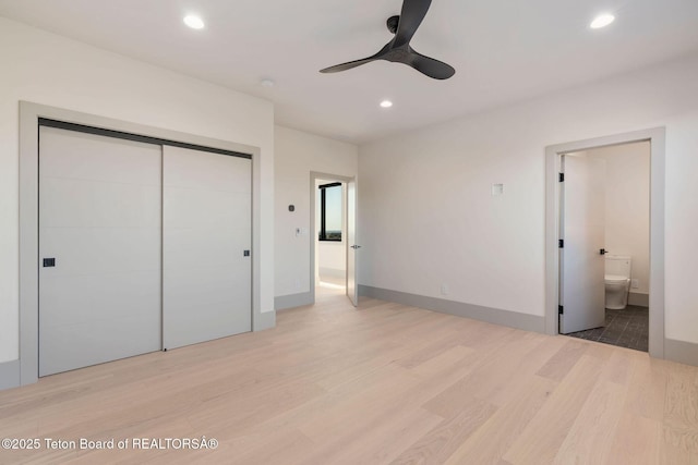 1404 Canyon Sunrise, Driggs, ID 83422 - unfurnished bedroom featuring wood finished floors, recessed lighting, a closet, ensuite bath, and baseboards