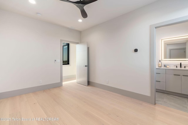 1404 Canyon Sunrise, Driggs, ID 83422 - unfurnished bedroom featuring light wood finished floors, recessed lighting, baseboards, and ensuite bath