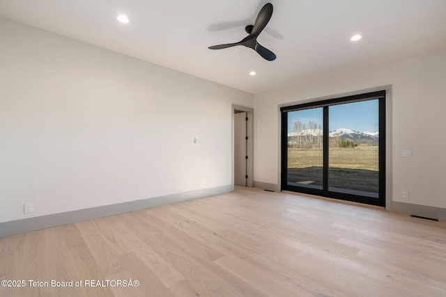 1404 Canyon Sunrise, Driggs, ID 83422 - unfurnished room with a ceiling fan, light wood-type flooring, recessed lighting, and baseboards