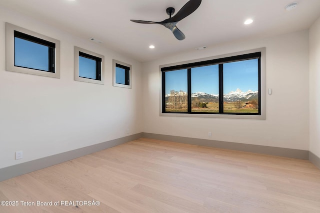 1404 Canyon Sunrise, Driggs, ID 83422 - unfurnished room featuring a ceiling fan, a smoke detector, light wood-style flooring, recessed lighting, and baseboards