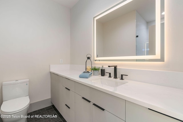 1404 Canyon Sunrise, Driggs, ID 83422 - full bathroom featuring vanity, toilet, a shower, baseboards, and tile patterned flooring