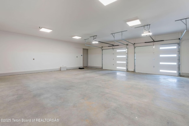 1404 Canyon Sunrise, Driggs, ID 83422 - garage with a garage door opener and baseboards