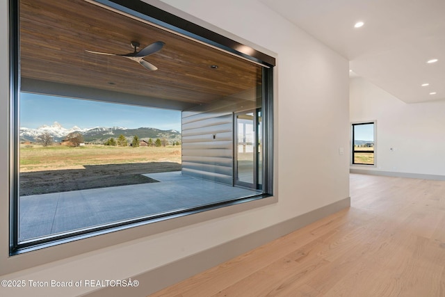1404 Canyon Sunrise, Driggs, ID 83422 - detailed view of wood finished floors, recessed lighting, baseboards, a mountain view, and a ceiling fan