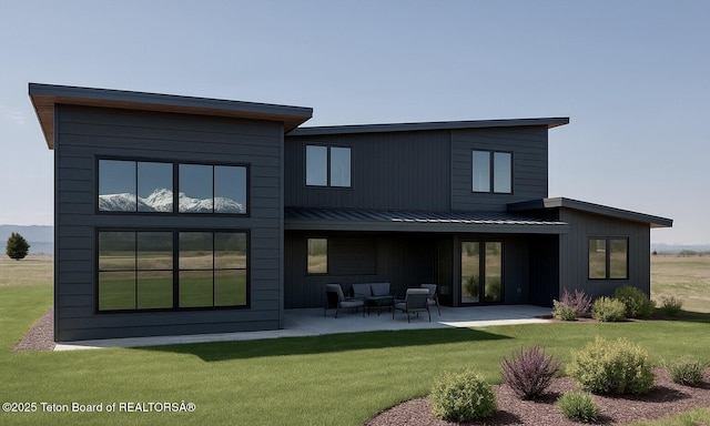 1404 Canyon Sunrise, Driggs, ID 83422 - back of property with a patio area, a lawn, metal roof, and a standing seam roof