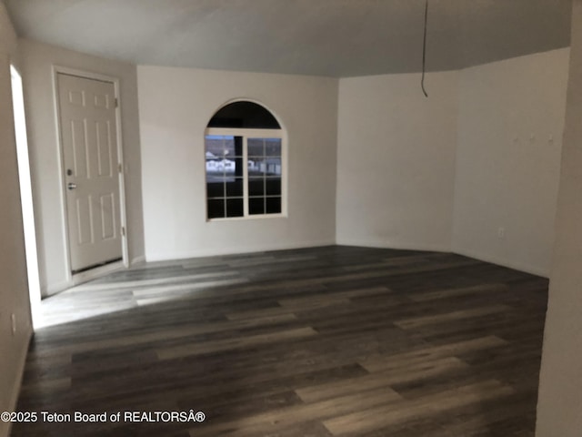 spare room featuring wood finished floors