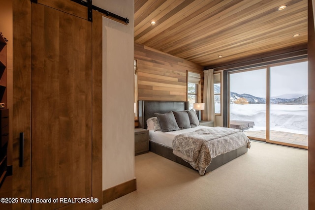 bedroom featuring a mountain view, recessed lighting, carpet flooring, wood ceiling, and access to exterior