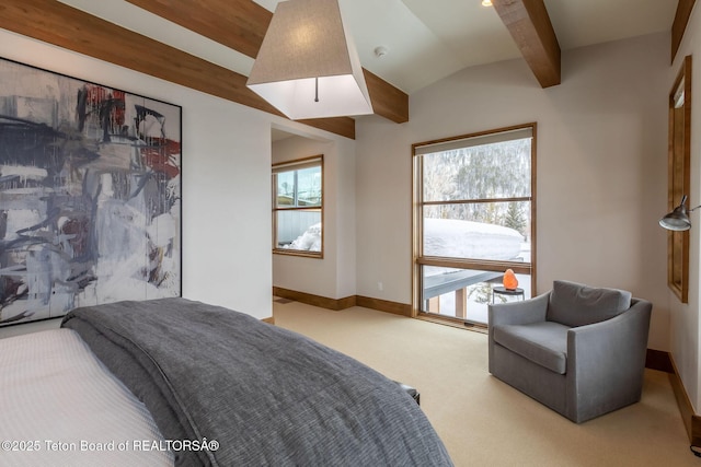 carpeted bedroom featuring baseboards and vaulted ceiling with beams