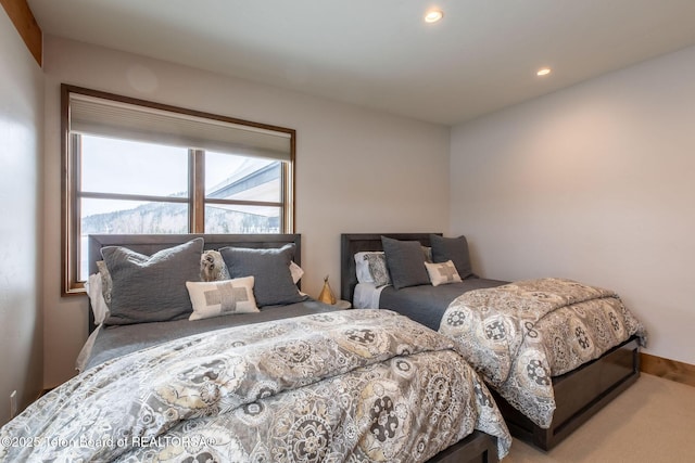 carpeted bedroom with recessed lighting