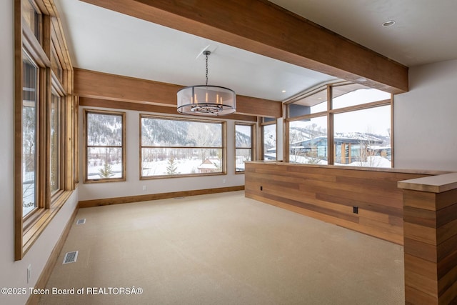 unfurnished sunroom featuring a chandelier and visible vents