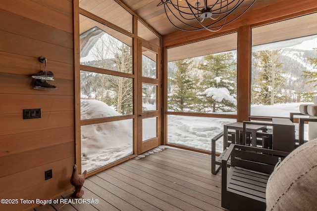 sunroom with an inviting chandelier and plenty of natural light