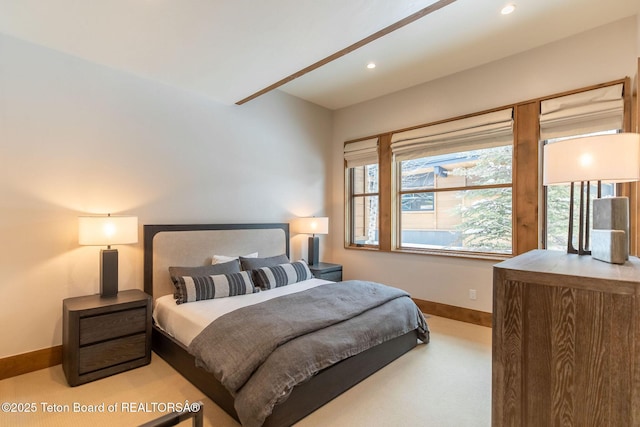 carpeted bedroom featuring baseboards, multiple windows, and recessed lighting