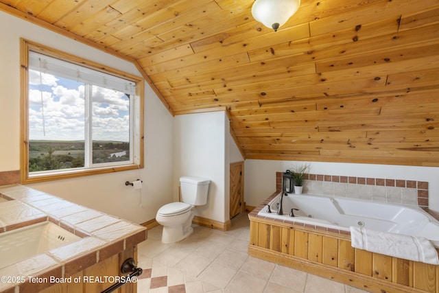 bathroom with toilet, a sink, a tub with jets, wooden ceiling, and vaulted ceiling