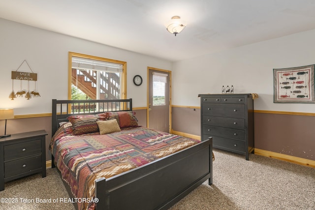 bedroom featuring baseboards and carpet floors