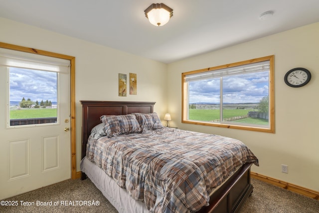 bedroom with carpet flooring and baseboards