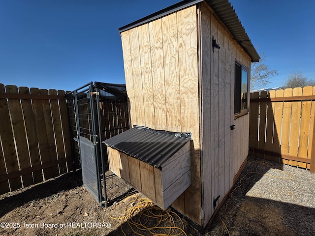 view of shed featuring a fenced backyard