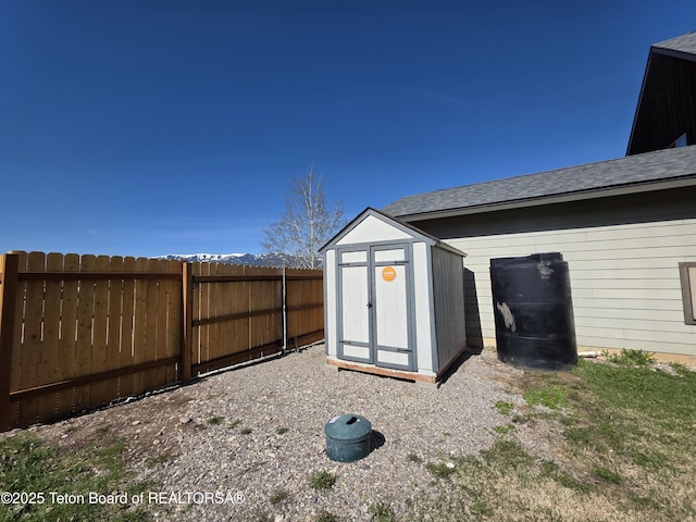 view of shed featuring a fenced backyard