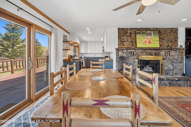 9 Warm Springs Rd, Dubois, WY 82513 - dining room with a fireplace, ceiling fan, recessed lighting, and wood finished floors