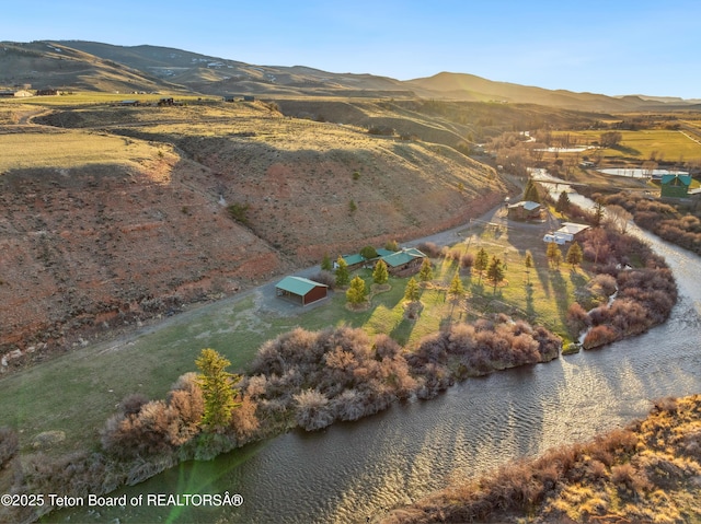 9 Warm Springs Rd, Dubois, WY 82513 - birds eye view of property with a water and mountain view