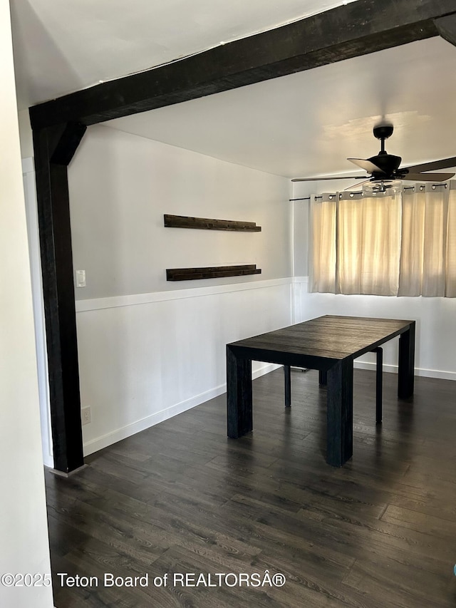 game room with ceiling fan, dark wood finished floors, baseboards, and beam ceiling