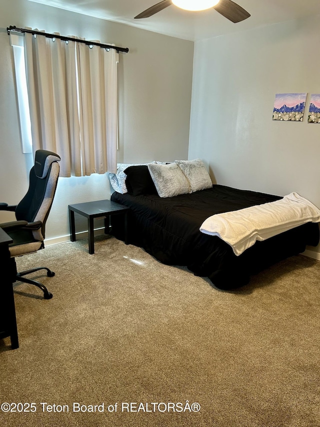 bedroom featuring carpet flooring and baseboards