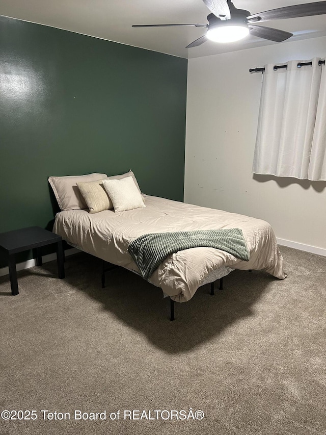 bedroom with carpet flooring, a ceiling fan, and baseboards