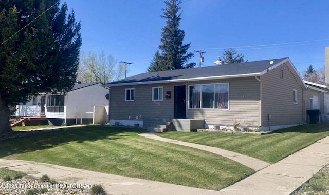 721 Ash Ave, Kemmerer, WY 83101 - view of front of home featuring a front yard and entry steps