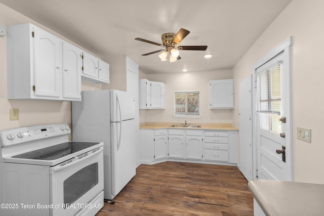 519 Jefferson, Afton, WY 83110 - kitchen with white appliances, a sink, white cabinets, recessed lighting, and dark wood-style floors