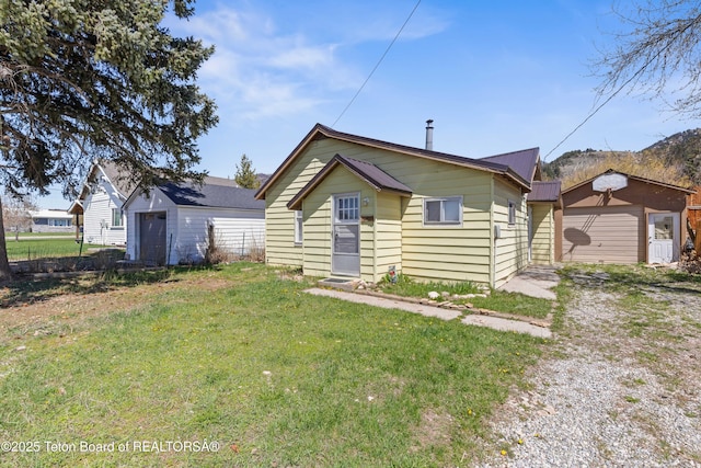 519 Jefferson, Afton, WY 83110 - bungalow featuring an outbuilding, a front lawn, and metal roof
