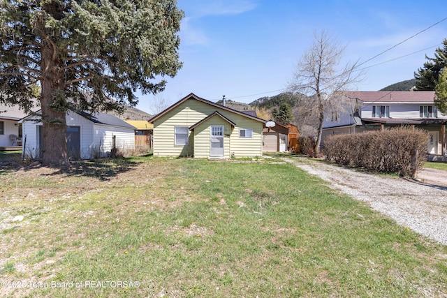 519 Jefferson, Afton, WY 83110 - view of front of property featuring an outbuilding and a front yard