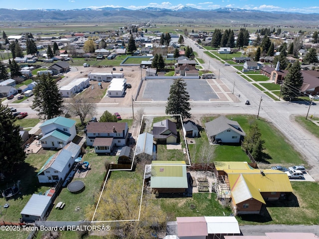 519 Jefferson, Afton, WY 83110 - aerial perspective of suburban area featuring property parcel outlined and a mountain backdrop