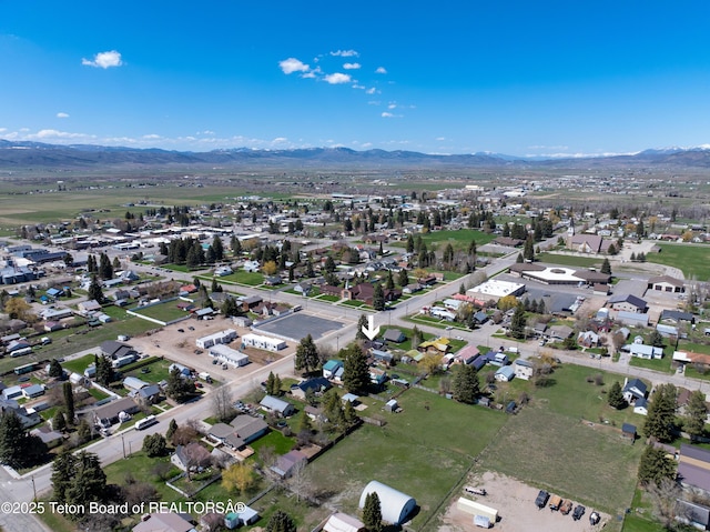 519 Jefferson, Afton, WY 83110 - aerial view of property's location featuring nearby suburban area and a mountain backdrop