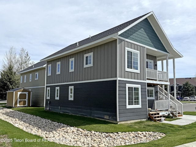 650 Centennial Mountain St, Driggs, ID 83422 - back of property with board and batten siding and a yard
