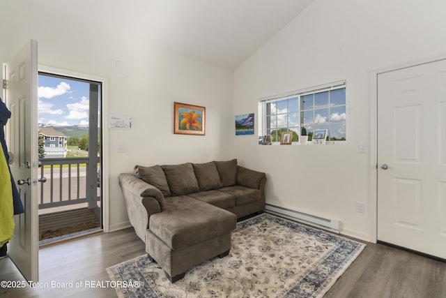 650 Centennial Mountain St, Driggs, ID 83422 - living room featuring a baseboard heating unit, wood finished floors, plenty of natural light, high vaulted ceiling, and baseboards
