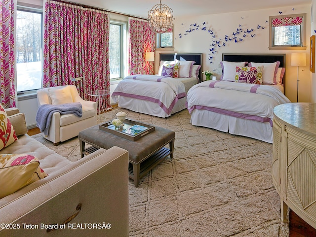 2985 N Alder Wood Ln, Wilson, WY 83014 - bedroom featuring a chandelier