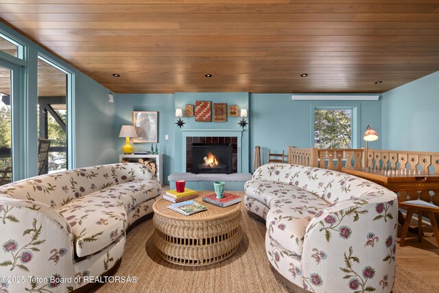 735 Snow King Dr, Jackson, WY 83001 - living area featuring wooden ceiling and a brick fireplace