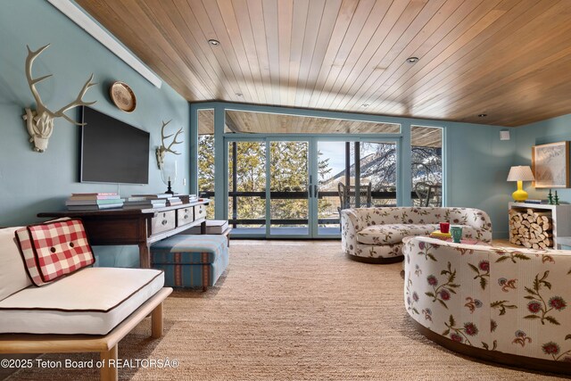 735 Snow King Dr, Jackson, WY 83001 - carpeted living room with wooden ceiling and a wall of windows