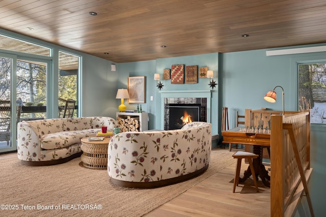 735 Snow King Dr, Jackson, WY 83001 - living room featuring wooden ceiling, a tile fireplace, and wood finished floors