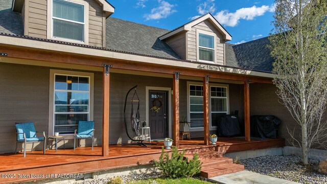 350 Little Greys Loop, Etna, WY 83118 - property entrance with covered porch and a shingled roof