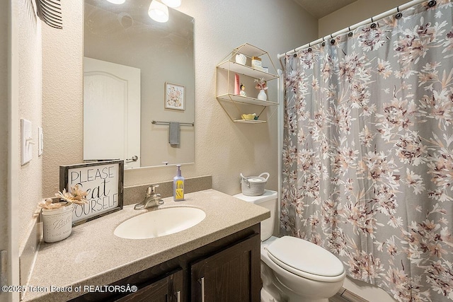 350 Little Greys Loop, Etna, WY 83118 - full bathroom with toilet, vanity, a textured wall, and curtained shower
