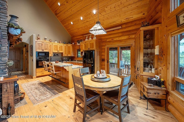 109 Redwood Rd, Star Valley Ranch, WY 83127 - dining area with wooden ceiling, light wood-style flooring, high vaulted ceiling, recessed lighting, and arched walkways