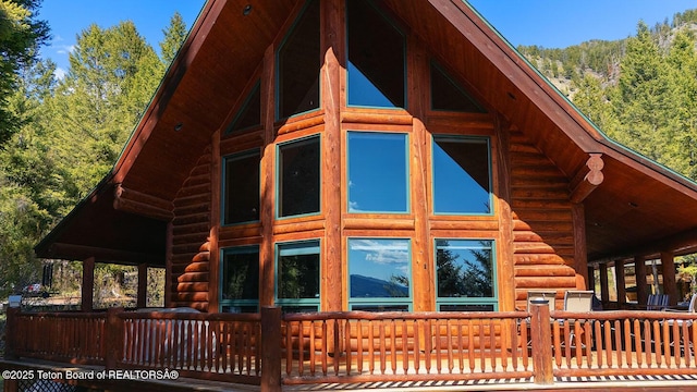 109 Redwood Rd, Star Valley Ranch, WY 83127 - view of side of property featuring log exterior and a view of trees