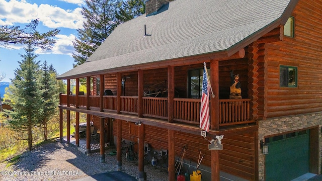 109 Redwood Rd, Star Valley Ranch, WY 83127 - view of home's exterior with log siding, a shingled roof, and a chimney