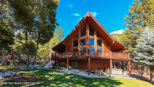 109 Redwood Rd, Star Valley Ranch, WY 83127 - back of property with a hot tub, a deck, a lawn, and a patio area