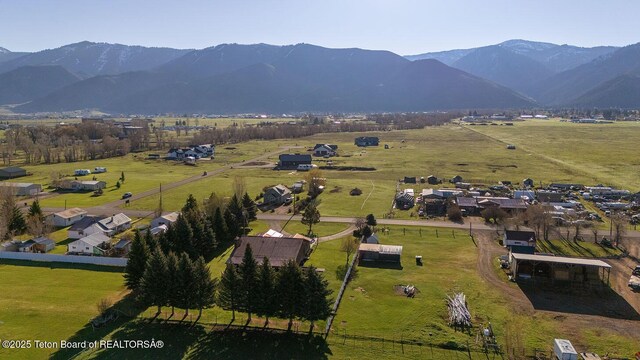 823 Allred Rd, Afton, WY 83110 - aerial view of property and surrounding area featuring rural landscape, a mountain backdrop, and agricultural land