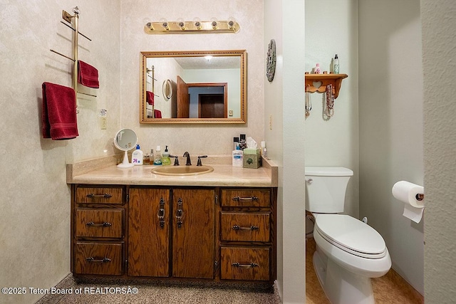823 Allred Rd, Afton, WY 83110 - bathroom featuring vanity, toilet, and baseboards